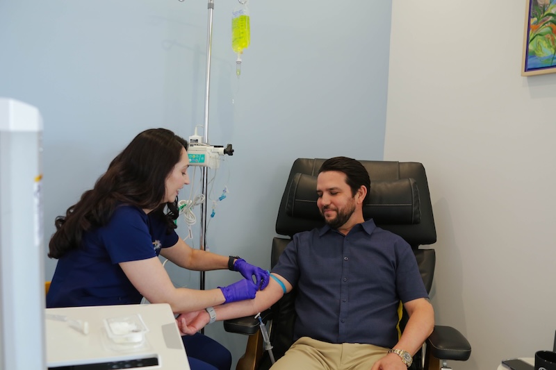 A nurse administering an infusion