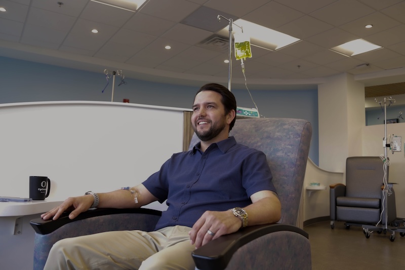 A patient relaxing in an infusion chair